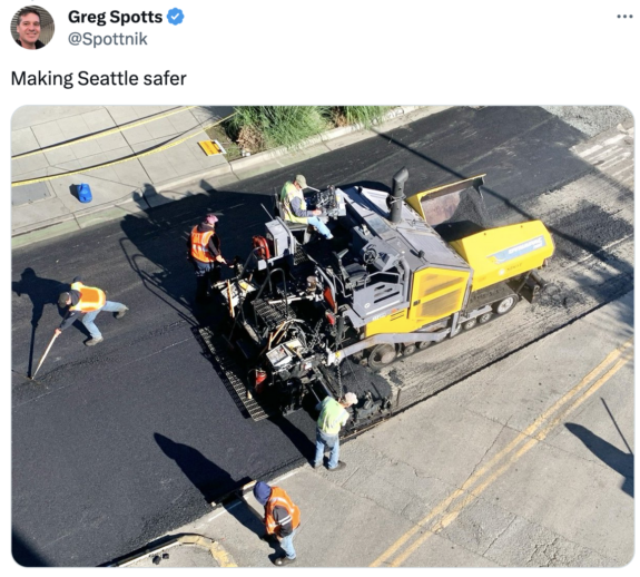 Screenshot of tweet by SDOT Director Greg Spotts with an overhead photo of workers using a large paving machine with smooth asphalt behind it. Text says Making Seattle safer.